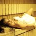 A woman enjoying relaxation in a cozy sauna, promoting wellness and peace.
