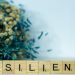 a scrabble type block spelling the word resilince